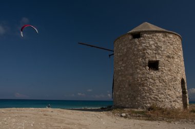 Windmill and paragliders on Lefkada clipart