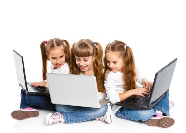 Three attractive girl using a laptop clipart