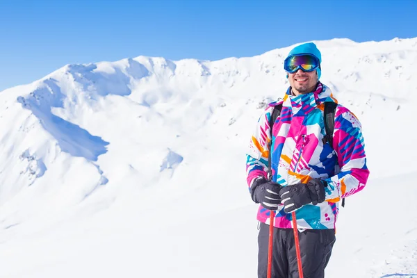 stock image Young man with skis and a ski wear