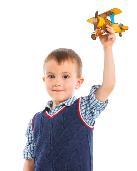 Aranyos kisfiú játszik egy játék repülőgép — Stock Fotó