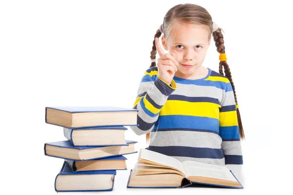 Menina com livros agitando o dedo em branco isolado — Fotografia de Stock