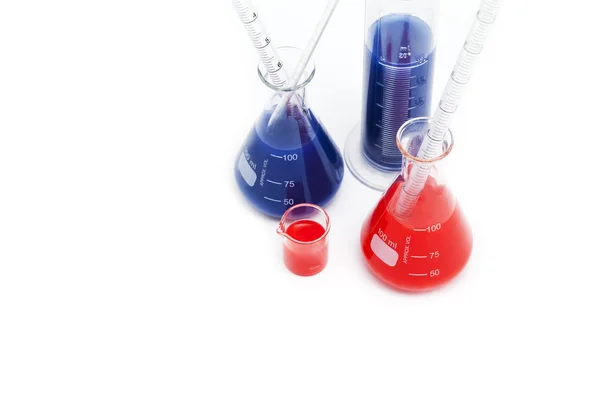 Laboratory flasks with chemicals — Stock Photo, Image