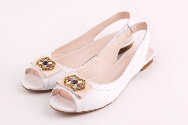 Pair of elegant women's shoes white low heels — Stock Photo, Image
