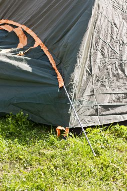 Putting up tent in a camping clipart