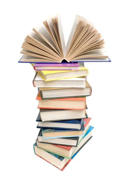 Open book on a pile of books on a white background — Stock Photo, Image