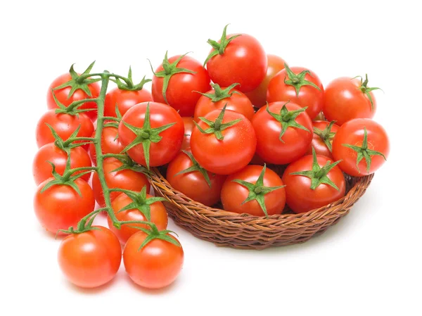 Tomates cherry sobre un fondo blanco de cerca —  Fotos de Stock