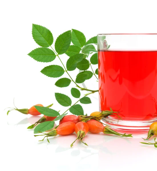 stock image Berry wild rose and a cup of tea on a white background