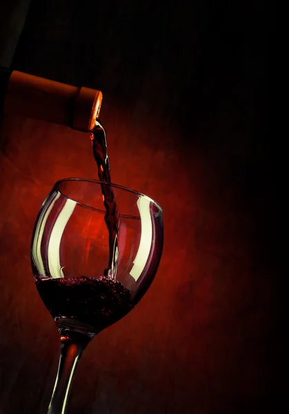 Red wine pouring down Stock Image
