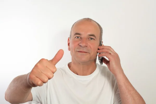 Man of fifty with a mobile phone — Stock Photo, Image