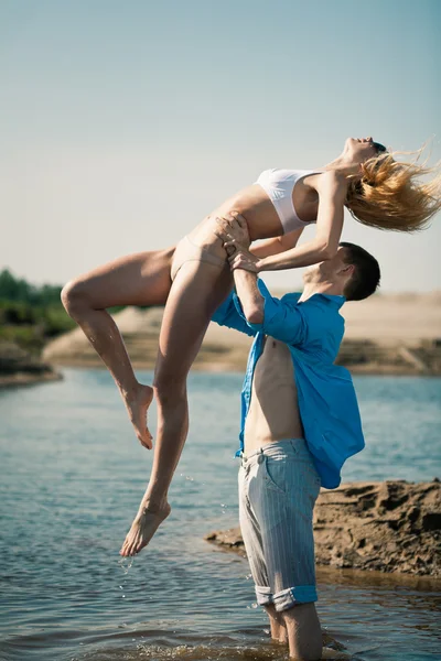 Couple having fun in water — Stock Photo, Image
