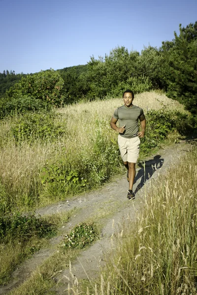 Young Man Running on Beach Trail — Stock Photo, Image