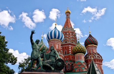 Monument to Minin and Pozharsky and St. Basil's Cathedral on the background of blue sky. Red Square. The Kremlin, Moscow clipart