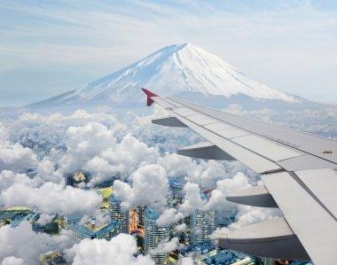 Surreal view of Mt.Fuji view from air plane clipart