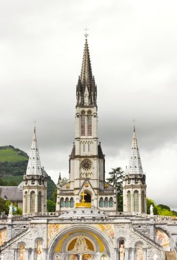 View of cathedral in Lourdes clipart