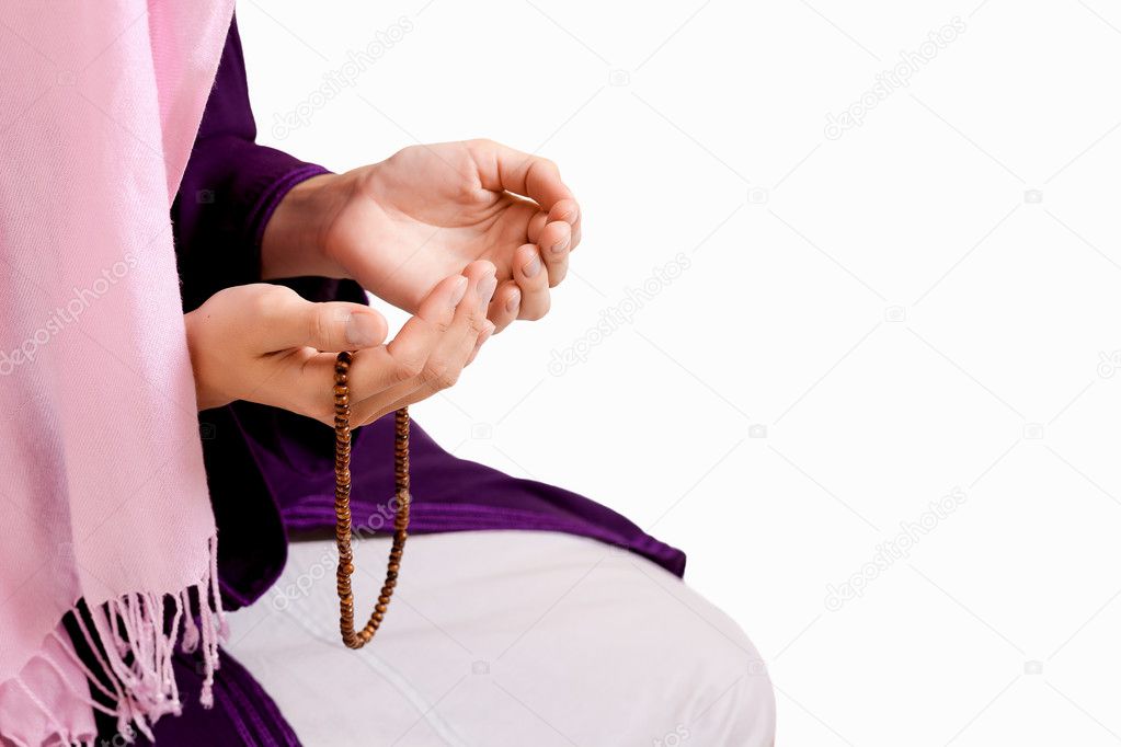 Muslim girl praying at mosque