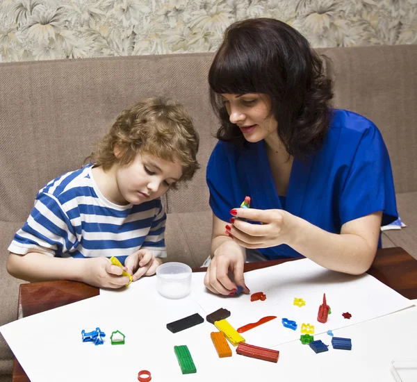 Mother and sun modelling with plasticine — Stock Photo, Image