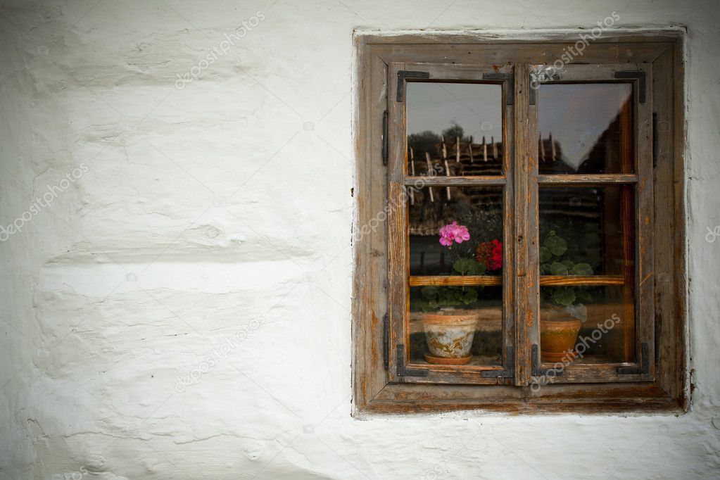 Vintage looking window of an old wooden house