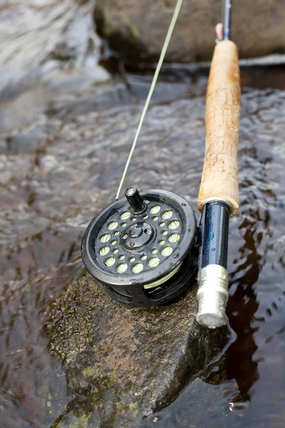Flyfishing rod on a river bank. — Stock Photo, Image