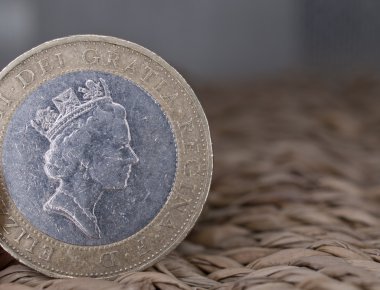 Close up of british currency - 2 pounds coin clipart