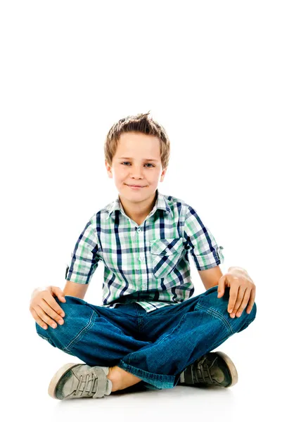 Sedící chlapec — Stock fotografie