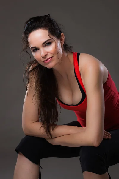 Beautiful fit woman resting after exercise — Stock Photo, Image