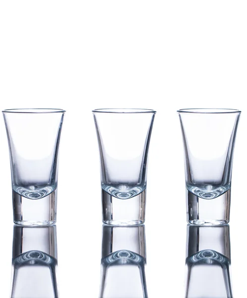 Three empty shot glasses — Stock Photo, Image