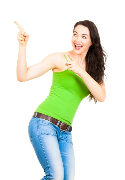 Young beautiful woman pointing to copyspace — Stock Photo, Image