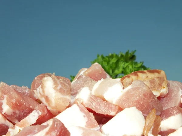 Prosciutto cortar em dados bacon em close-up — Fotografia de Stock