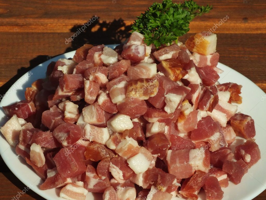 Prosciutto cut into dice bacon into close up ⬇ Stock Photo, Image by