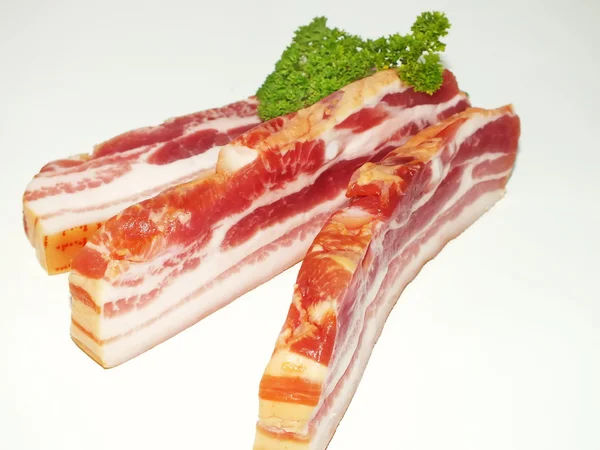 Prosciutto cut into dice bacon into close up — Stock Photo, Image