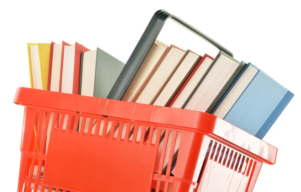 Cesta de compras de plástico com livros isolados em branco — Fotografia de Stock