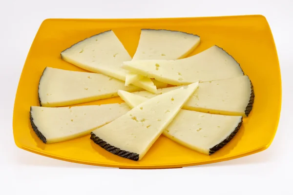 Algumas fatias de queijo manchego — Fotografia de Stock