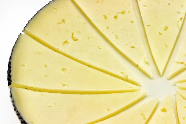 Algunas rebanadas de queso manchego — Foto de Stock