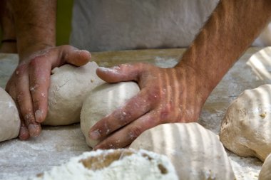 Baker kneading bread clipart