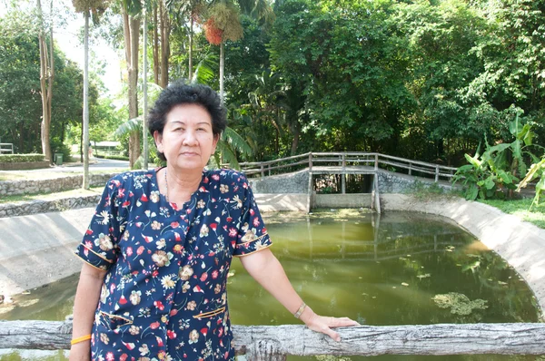 Asian senior woman in park — Stock Photo, Image