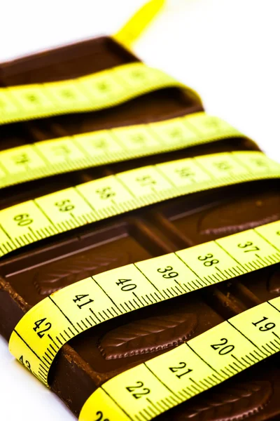 Çikolata ve şerit metre — Stok fotoğraf