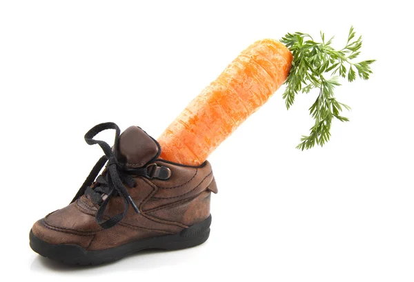 Carrot in shoe — Stock Photo, Image