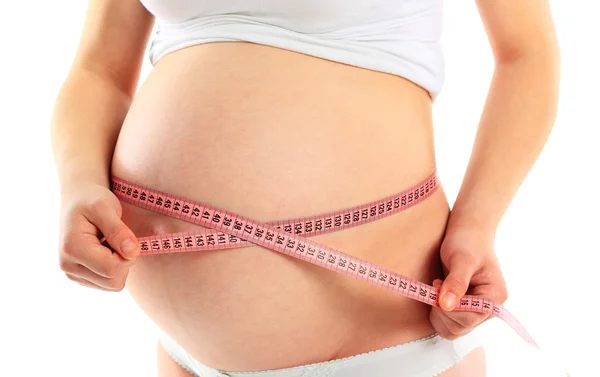 Těhotná žena s šití metr a pěkné břicho — Stock fotografie
