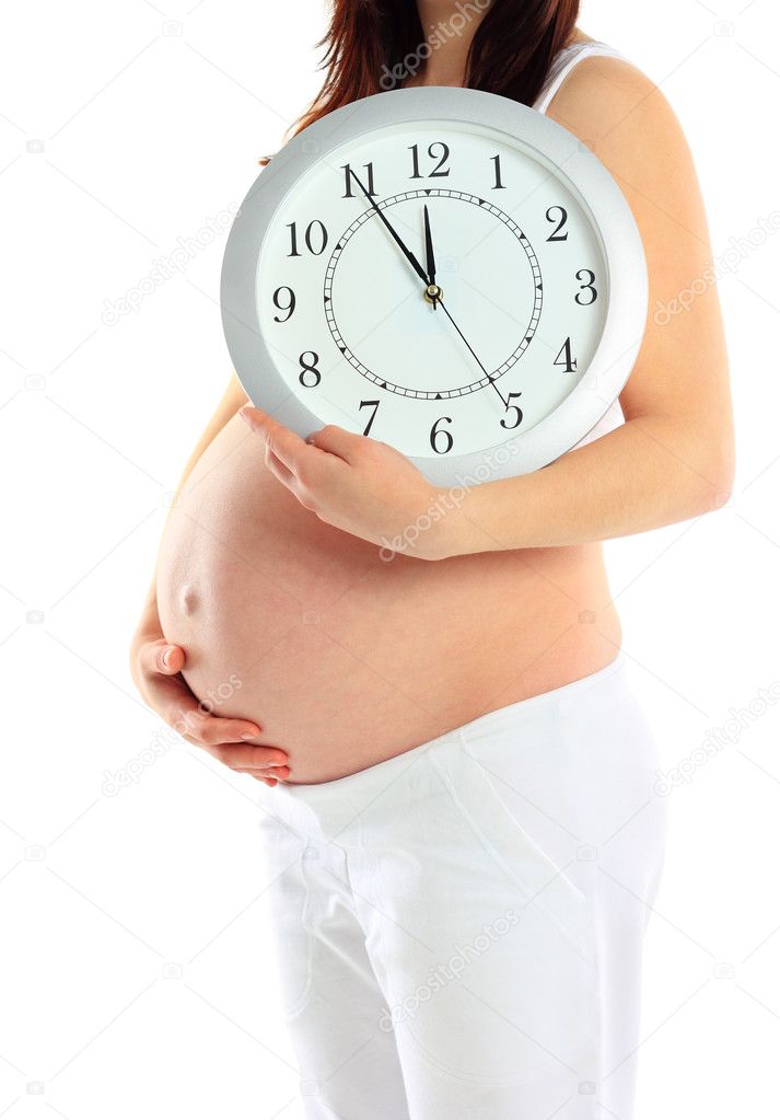 Pregnant woman with clock isolated on white