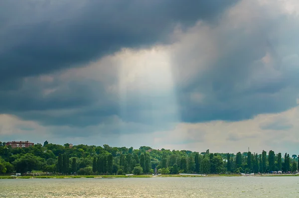 stock image Clouds over the sea shore