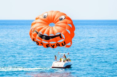 The parachute attached to the boat clipart