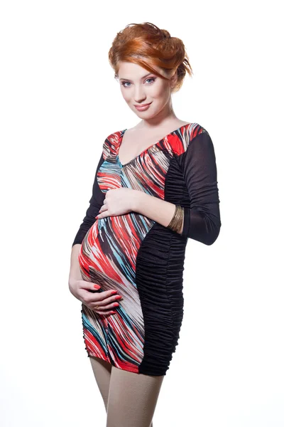 Szép terhes nő tartja a hasát. Elszigetelt fehér ba — Stock Fotó