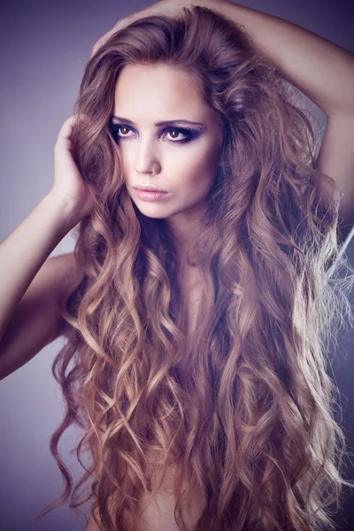 Sexy young woman with beautiful long hair — Stock Photo, Image