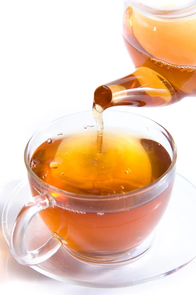 stock image A cup of hot tea and a teapot