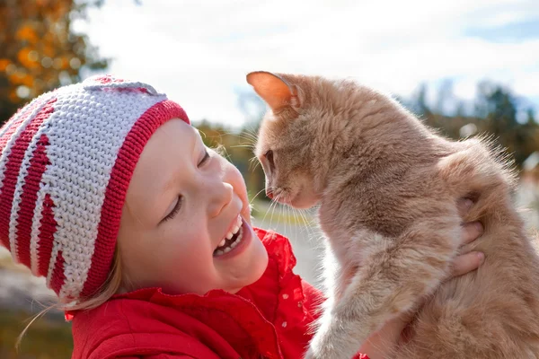 stock image Little girl holding a cat