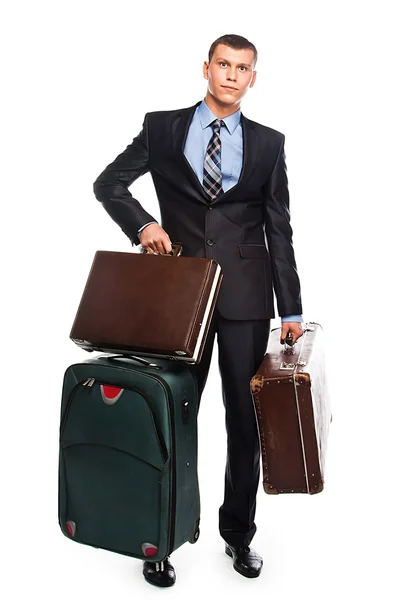 Jovem empresário com três malas — Fotografia de Stock