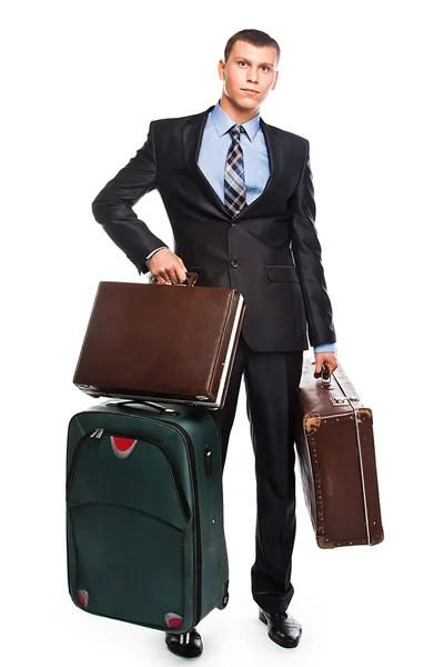 Jovem empresário com três malas — Fotografia de Stock