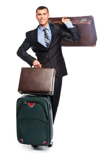 Młody biznesmen z trzema walizkami — Zdjęcie stockowe