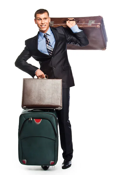 Young businessman with three suitcases Royalty Free Stock Photos
