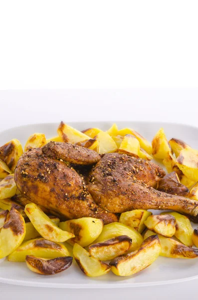 Stock image Chickens roast with baking potatoes